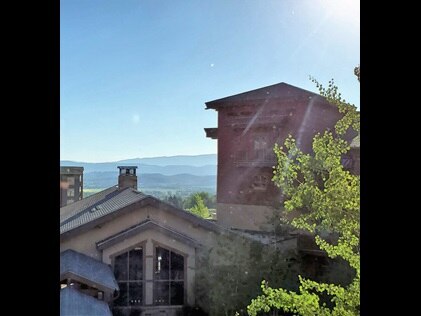 Sunrise coming up over mountains at Sunrise Lodge, a Hilton Grand Vacations Club in Park City, Utah.