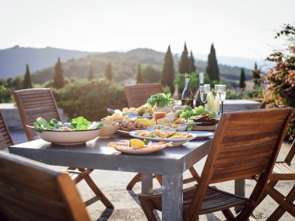 A table set for lunch with a view of Tuscany, Italy