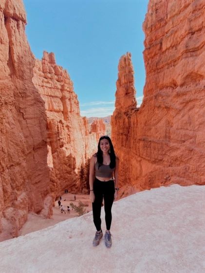 Hilton Grand Vacations Owner Raeanne at Bryce Canyon in Utah while on a pet-friendly road trip