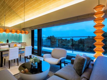 A living room and kitchen in a Suite at The Bay Forest Odawara, a Hilton Club